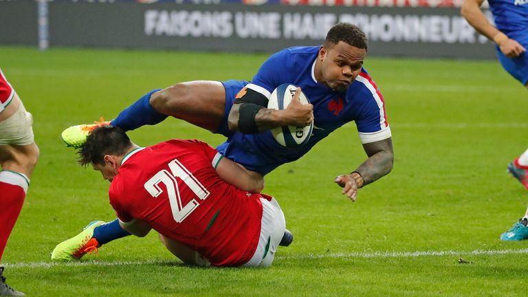 France's Virimi Vakatawa is tackled by Wales replacement Tomos Williams