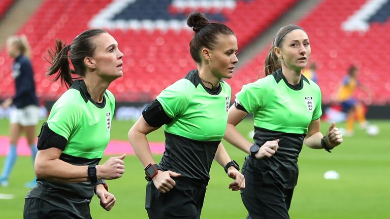Rebecca Welch, centre, warms up with Sian Massey-Ellis, right, ahead of the Women's FA Cup final at Wembley
