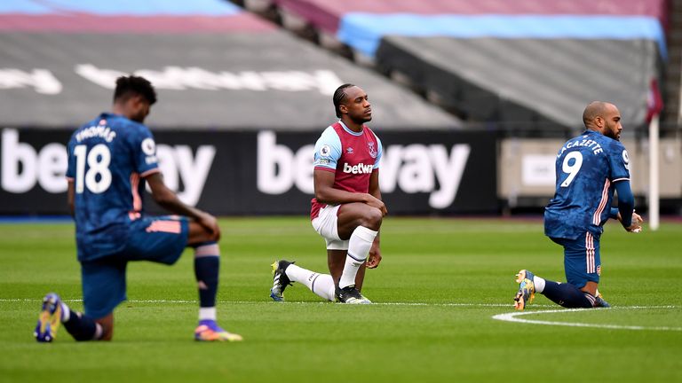 West Ham United v Arsenal - Premier League - London Stadium
West Ham United&#39;s Michail Antonio (centre), Arsenal&#39;s Alexandre Lacazette (right) and Thomas Partey take a knee in support of the Black Lives Matter movement ahead of the Premier League match at the London Stadium, London. Picture date: Sunday March 21, 2021.