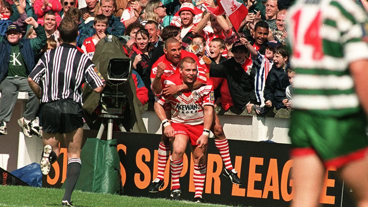 PA NEWS PHOTO 26/8/96 ST.HELENS FANS CELEBRATE AS ANTHONY SULLIVAN CONGRATULATES CAPTAIN BOBBY GOULDING AFTER HE SCORED A TRY IN THEIR VICTORTY OVER WARRINGTON TO BECOME THE FIRST SUPER LEAGUE CHAMPIONSA