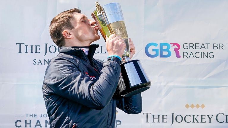 ESHER, ENGLAND - APRIL 24: Harry Skelton celebrates with his Champion Jockey trophy for the national hunt season 2020-21 at Sandown Park Racecourse on April 24, 2021 in Esher, England. Sporting venues around the UK remain under restrictions due to the Coronavirus Pandemic. Only owners are allowed to attend the meeting but the public must wait until further restrictions are lifted. (Photo by Alan Crowhurst/Getty Images)