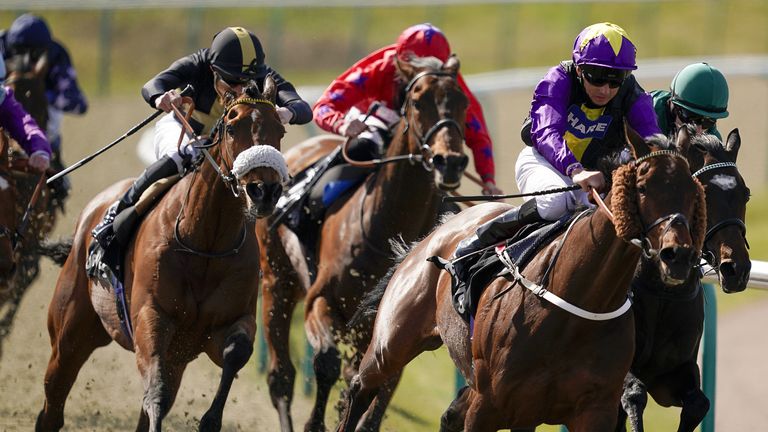 Ranch Hand ridden by James Doyle (left) on their way to winning at Lingfield