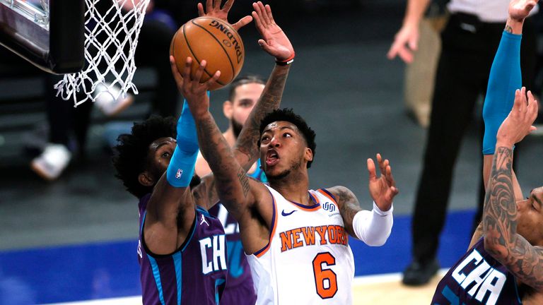 New York Knicks&#39; Elfrid Payton goes to the basket as Charlotte Hornets&#39; Jalen McDaniels, left, and P.J. Washington defend during the second half of an NBA basketball game Tuesday, April 20, 2021, in New York.