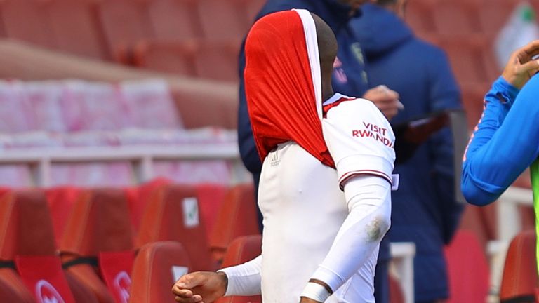 Alexandre Lacazette trudges off after picking up a hamstring injury