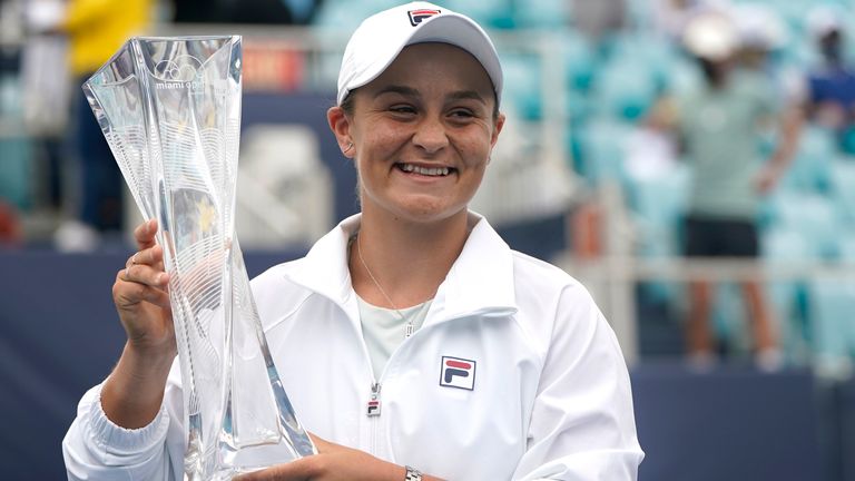 Ashleigh Barty of Australia poses with the trophy after winning her match against Bianca Andreescu of Canada during the finals at the Miami Open tennis tournament, Saturday, April 3, 2021, in Miami Gardens, Fla. Barty won 6-3, 4-0, as Andreescu retired due to injury. (AP Photo/Lynne Sladky)