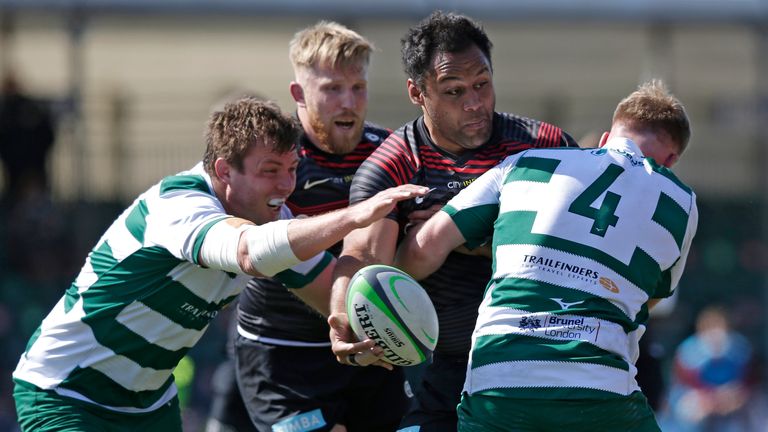 Billy Vunipola looks to offload out of a tackle Simon Linsell 