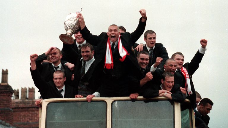 St Helens parade Cup
St Helens RLFC Capt Bobbie Goulding, centre, cant hide his delight as he arrives in the town centre with his rain soaked team mates and the Silk Cut Challenge Trophy.