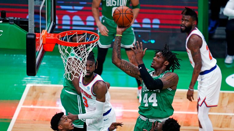 AP - Boston Celtics center Robert Williams III (44) shoots against the New York Knicks 
