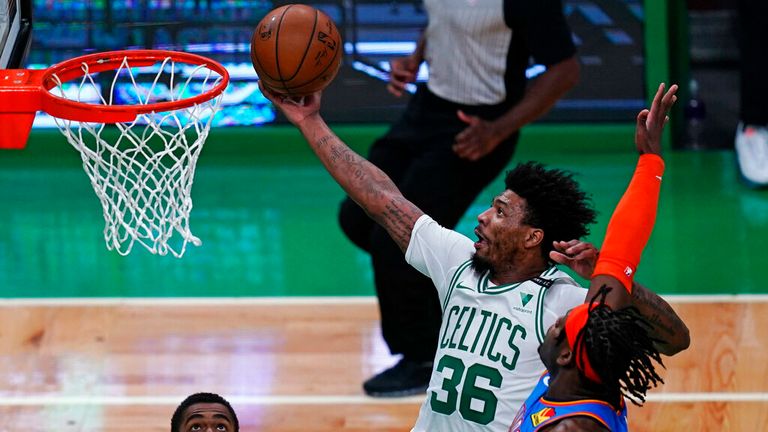 AP - Boston Celtics guard Marcus Smart (36) drives to the basket past Oklahoma City Thunder forward Luguentz Dort, 