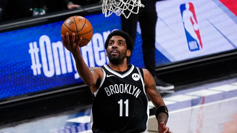 AP - Brooklyn Nets guard Kyrie Irving goes to the basket during the second half of an NBA basketball game against the Boston Celtics