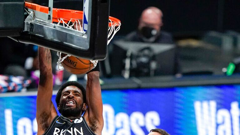 AP - Brooklyn Nets&#39; Kyrie Irving (11) dunks the ball 