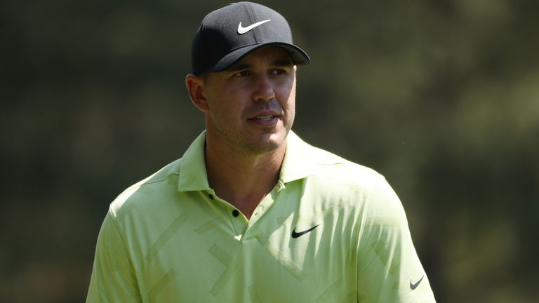 Brooks Koepka of the United States looks on from the fifth hole during a practice round prior to the Masters at Augusta National Golf Club