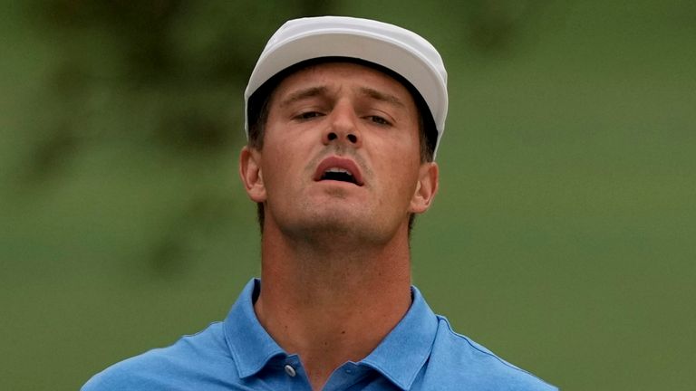 Bryson DeChambeau looks for his ball on the seventh hole during the second round of the Masters golf tournament on Friday, April 9, 2021, in Augusta, Ga. (AP Photo/Gregory Bull)              