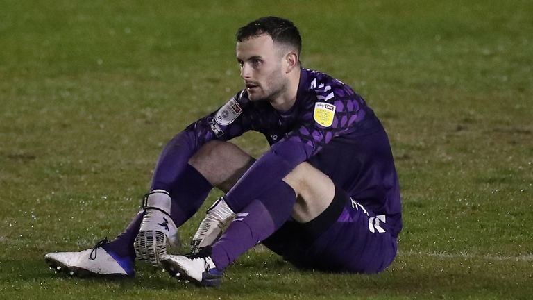 Cambridge keeper Callum Burton shows his dejection at full time