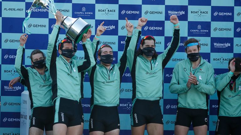 Cambridge men celebrate after defeating Oxford