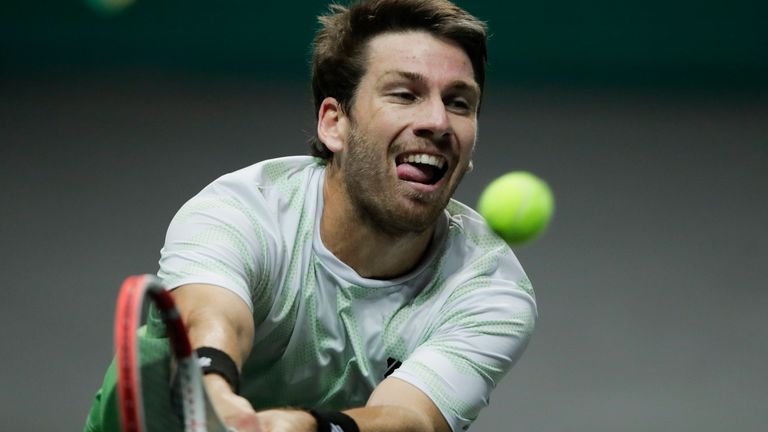 Britain...s Cameron Norrie plays a shot against Georgia's Nikoloz Basilashvili on the first round men's singles match of the ABN AMRO world tennis tournament at Ahoy Arena in Rotterdam, Netherlands, Monday, March 1, 2021. (AP Photo/Peter Dejong)