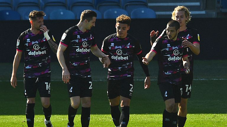 Max Aarons celebrates his strike with Norwich team-mates