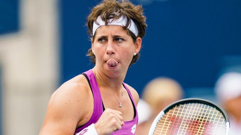Carla Suarez Navarro, of Spain, celebrates defeating Venus Williams in a first round match at the Rogers Cup tennis tournament in Toronto, Tuesday, Aug. 6, 2019. Suarez Navarro defeated Williams 6-4, 6-2. (Mark Blinch/The Canadian Press via AP)