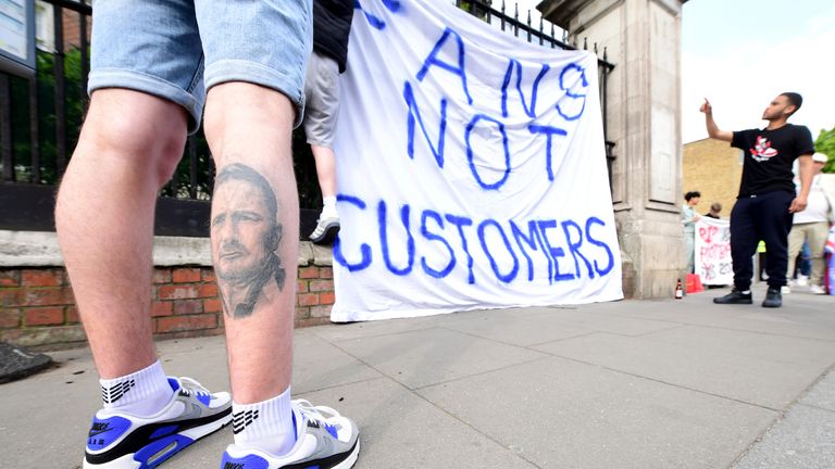 PA - Chelsea supporters display a 'fans not customers' banner in protest over plans for a European Super League