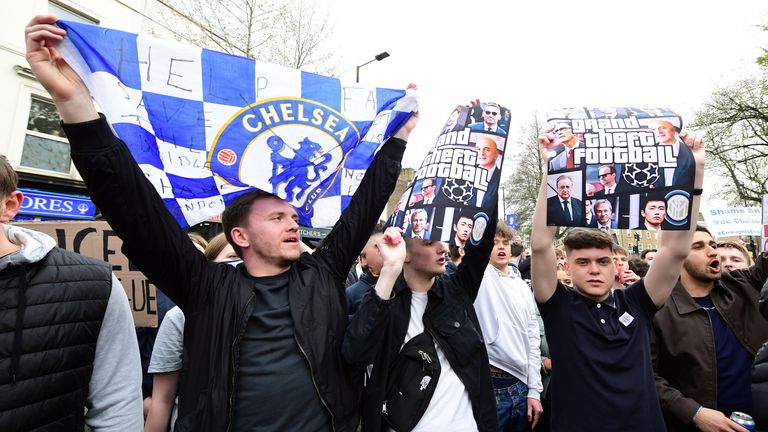 PA - Fans hold a Chelsea flag and &#39;grand theft football&#39; banner