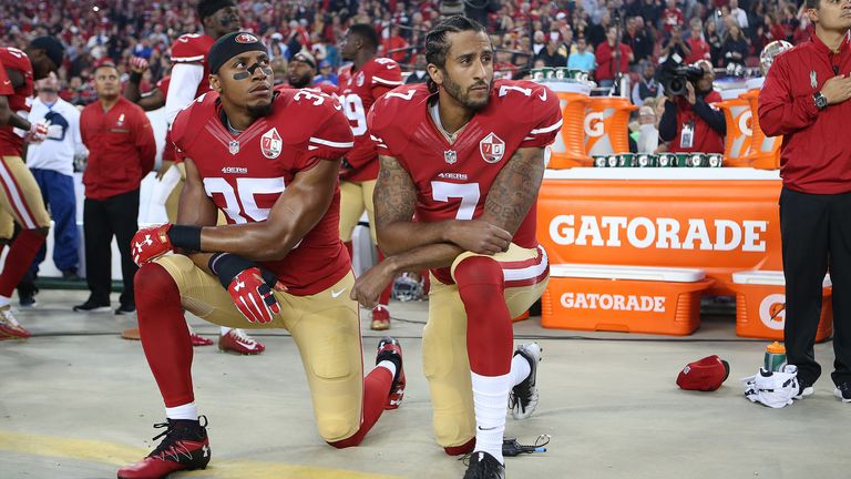 Eric Reid (35) and Colin Kaepernick (7) take a knee during the National Anthem prior to their 49ers' 2016 season opener against the Los Angeles Rams. (Daniel Gluskoter/AP Images for Panini)