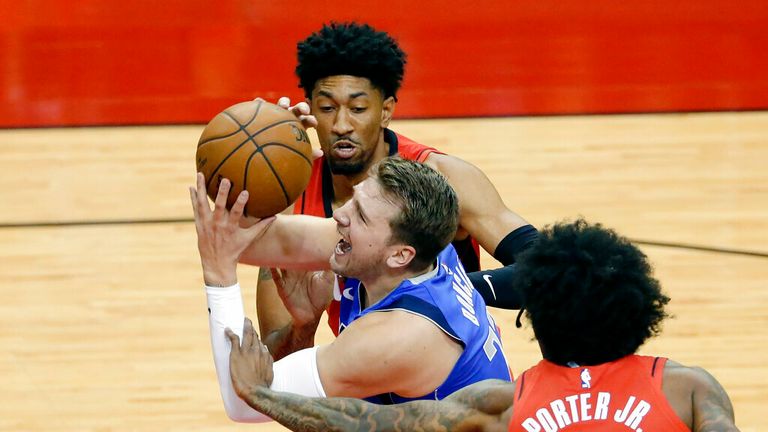 AP - Dallas Mavericks guard Luka Doncic (77) is fouled as he drives to the basket