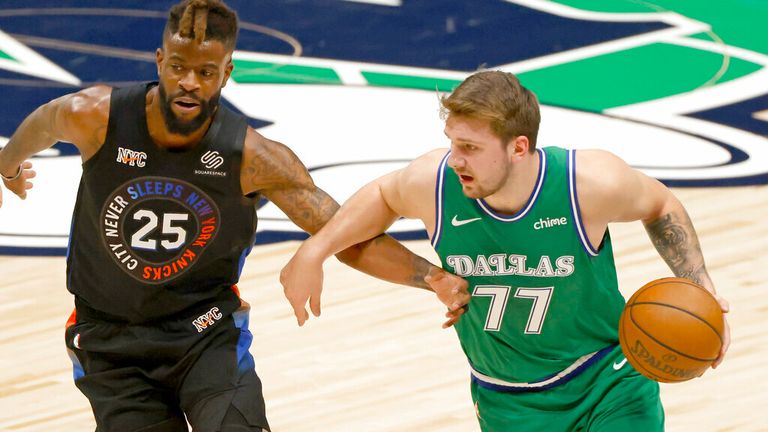 AP - Dallas Mavericks guard Luka Doncic (77) is defended by New York Knicks forward Reggie Bullock (25)