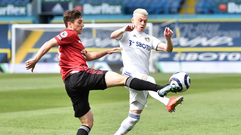 Daniel James challenges Leeds United's Ezgjan Alioski (AP)