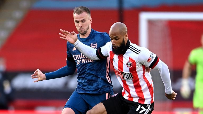 David McGoldrick holds the ball up with Rob Holding for company