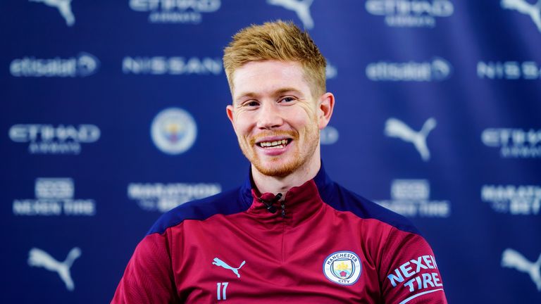 GETTY - Kevin de Bruyne is all smiles following the signing of his extended Manchester City deal