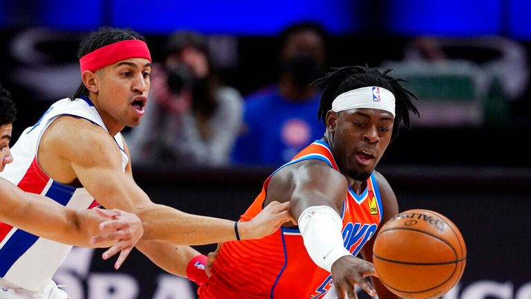 AP - Detroit Pistons guards Killian Hayes, left, Frank Jackson and Oklahoma City Thunder forward Luguentz Dort, right, reach for the loose ball