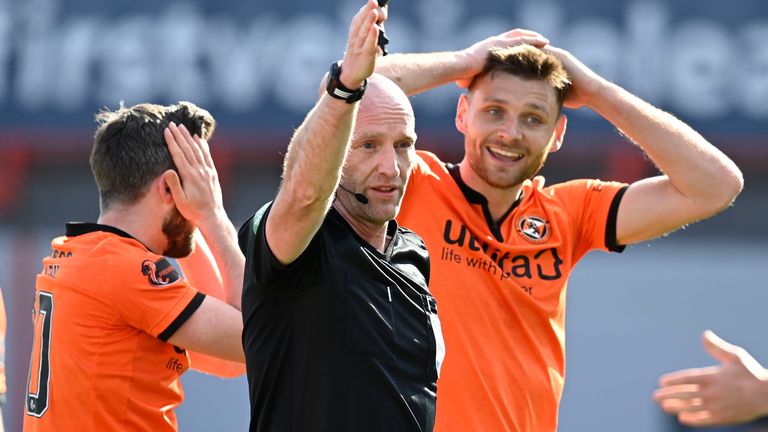 Ryan Edwards is in disbelief after Referee Bobby Madden waves off a penalty claim