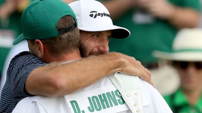 Nov. 15, 2020 - Augusta, Ga. - Dustin Johnson reacts after winning the 2020 Masters with his brother and caddie Austin Johnson on the 18th green Sunday at Augusta National. (Curtis Compton / Curtis.Compton@ajc.com)....