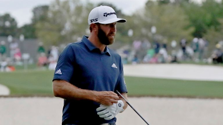 April 9, 2021, Augusta: Dustin Johnson looks over his shot in the fairway bunker on the eighteenth hole during the second round of the Masters at Augusta National Golf Club on Friday, April 9, 2021, in Augusta. Curtis Compton/ccompton@ajc.com.