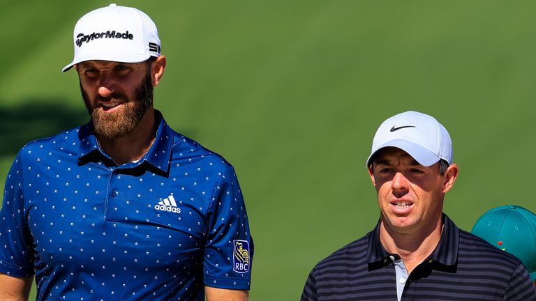 Masters champion Dustin Johnson and Rory McIlroy of Northern Ireland walk on the No. 7 green during Practice Round 1 for the Masters at Augusta National Golf Club, Monday, April 5, 2021. 