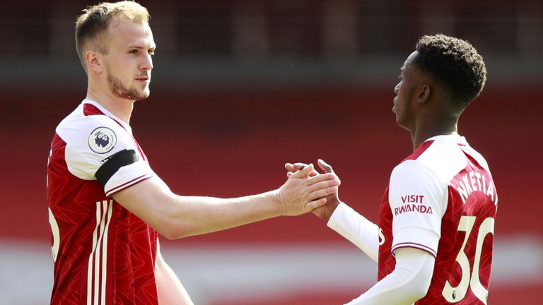 Rob Holding congratulates Eddie Nketiah after his late goal got Arsenal a draw against Fulham