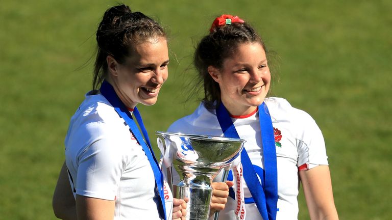 Emily Scarratt and Jess Breach celebrate with the trophy after England's win in the Six Nations final