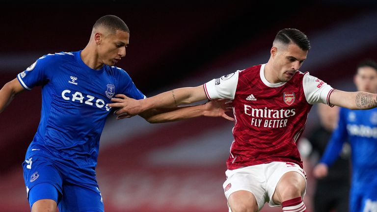 Richarlison closes down Granit Xhaka during a cagey opening half