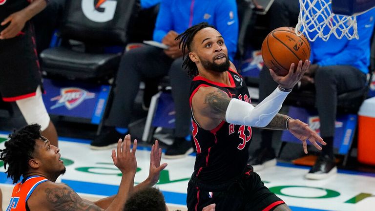 AP - Toronto Raptors guard Gary Trent Jr. (33) goes to the basket in front of Oklahoma City Thunder forward Josh Hall (15)
