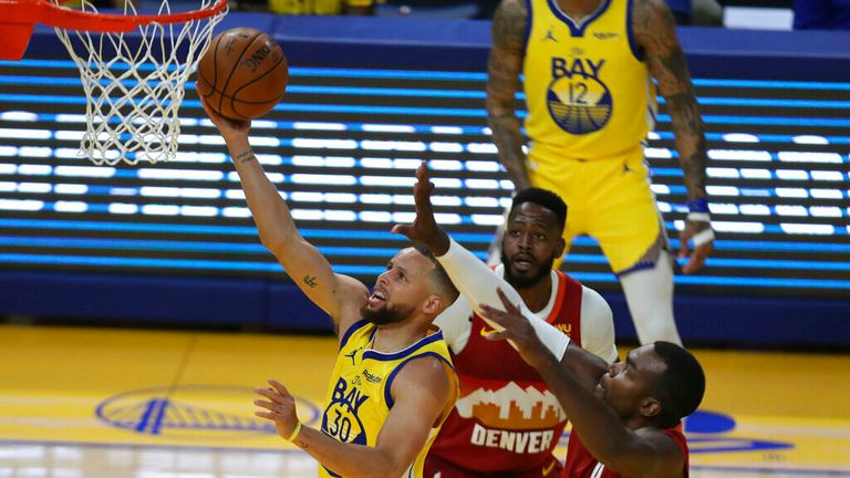 AP - Golden State Warriors&#39; Stephen Curry, left, shoots against Denver Nuggets&#39; Paul Millsap