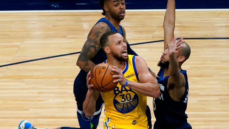 AP - Golden State Warriors&#39; Stephen Curry (30) eyes the basket as Minnesota Timberwolves&#39; Jordan McLaughlin (6) closes in