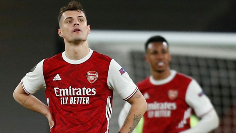 Granit Xhaka looks dejected after Slavia Prague's injury-time equaliser in the Europa League quarter-final first leg