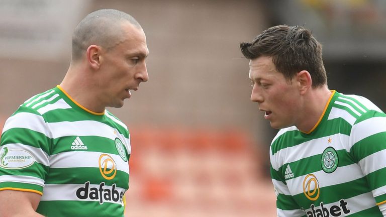 DUNDEE, SCOTLAND - MARCH 07: Callum McGregor with captain Scott Brown (left) in action for Celtic during a Scottish Premiership match between Dundee United and Celtic at Tannadice Park, on March 07, 2021, in Dundee, Scotland. (Photo by Craig Foy / SNS Group)