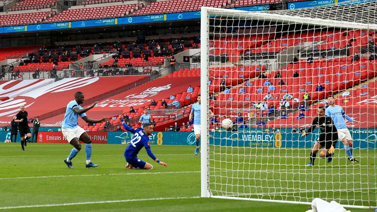 Hakim Ziyech readjusts his body to slide home the winner on Saturday