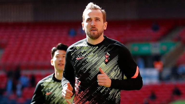 Harry Kane warms up ahead of the Carabao Cup final at Wembley (AP)