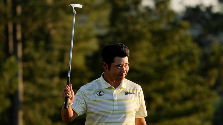 Hideki Matsuyama, of Japan, reacts after winning the Masters 