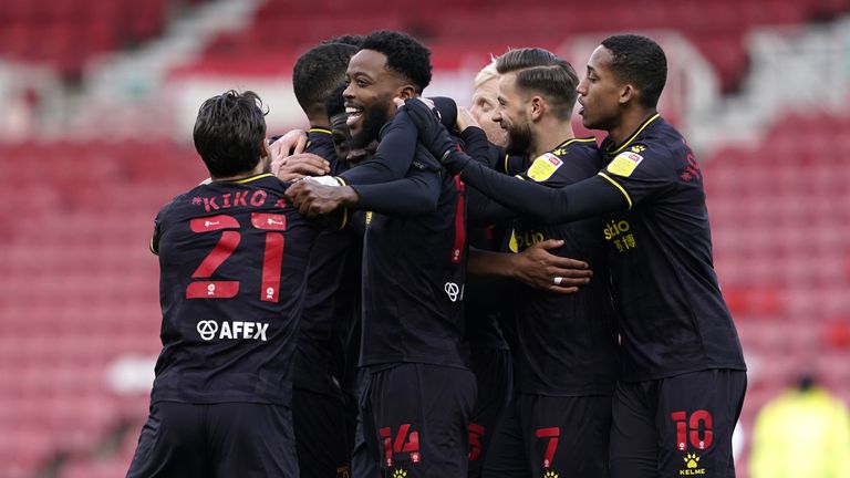 Watford's Ismaila Sarr is mobbed by team-mates after putting them 1-0 up