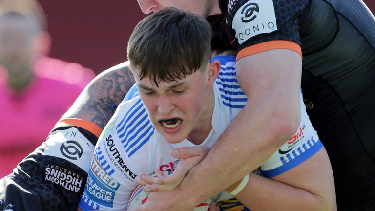 Leeds Rhinos v Castleford Tigers - Betfred Super League - Totally Wicked Stadium
Leeds Rhinos' Jack Broadbent (centre) is tackled by Castleford Tigers' Nathan Massey (left) during the Betfred Super League match at The Totally Wicked Stadium, St Helens. Picture date: Friday April 2, 2021.