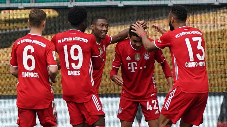 Jamal Musiala is congratulated after scoring for Bayern Munich