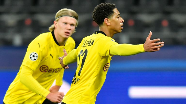 Dortmund's Jude Bellingham, right, celebrates after scoring his side's first goal during the Champions League quarterfinal second leg soccer match between Borussia Dortmund and Manchester City at the Signal Iduna Park stadium in Dortmund